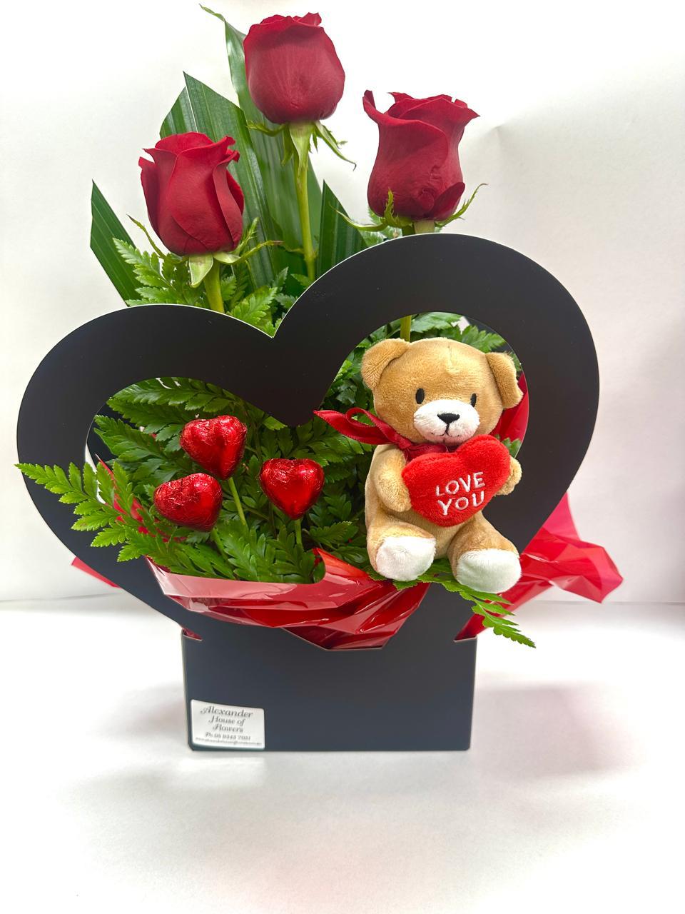 A Heart Rose Arrangement with Chocolates and Bear